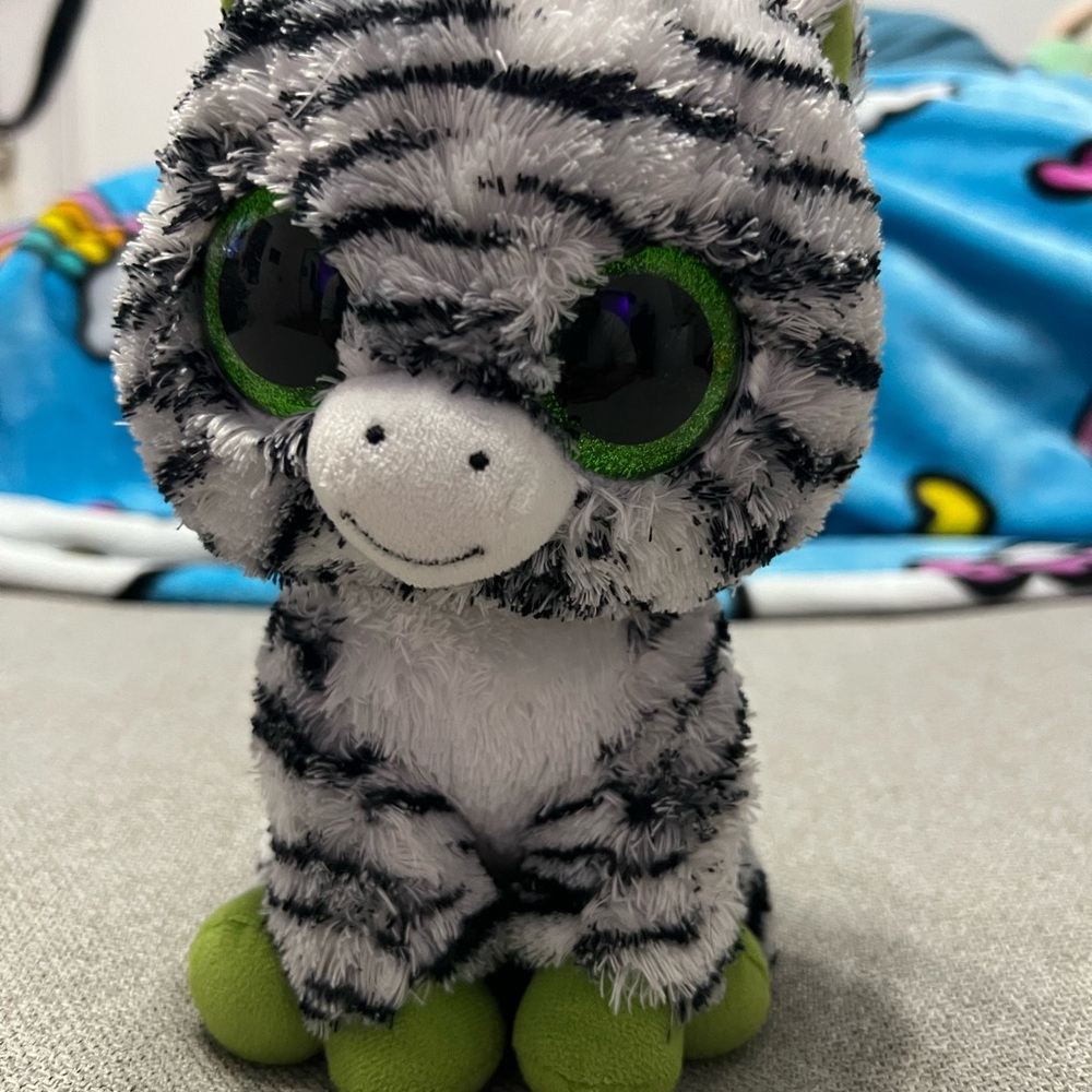 Adorable Striped Plush Toy with Green Accents